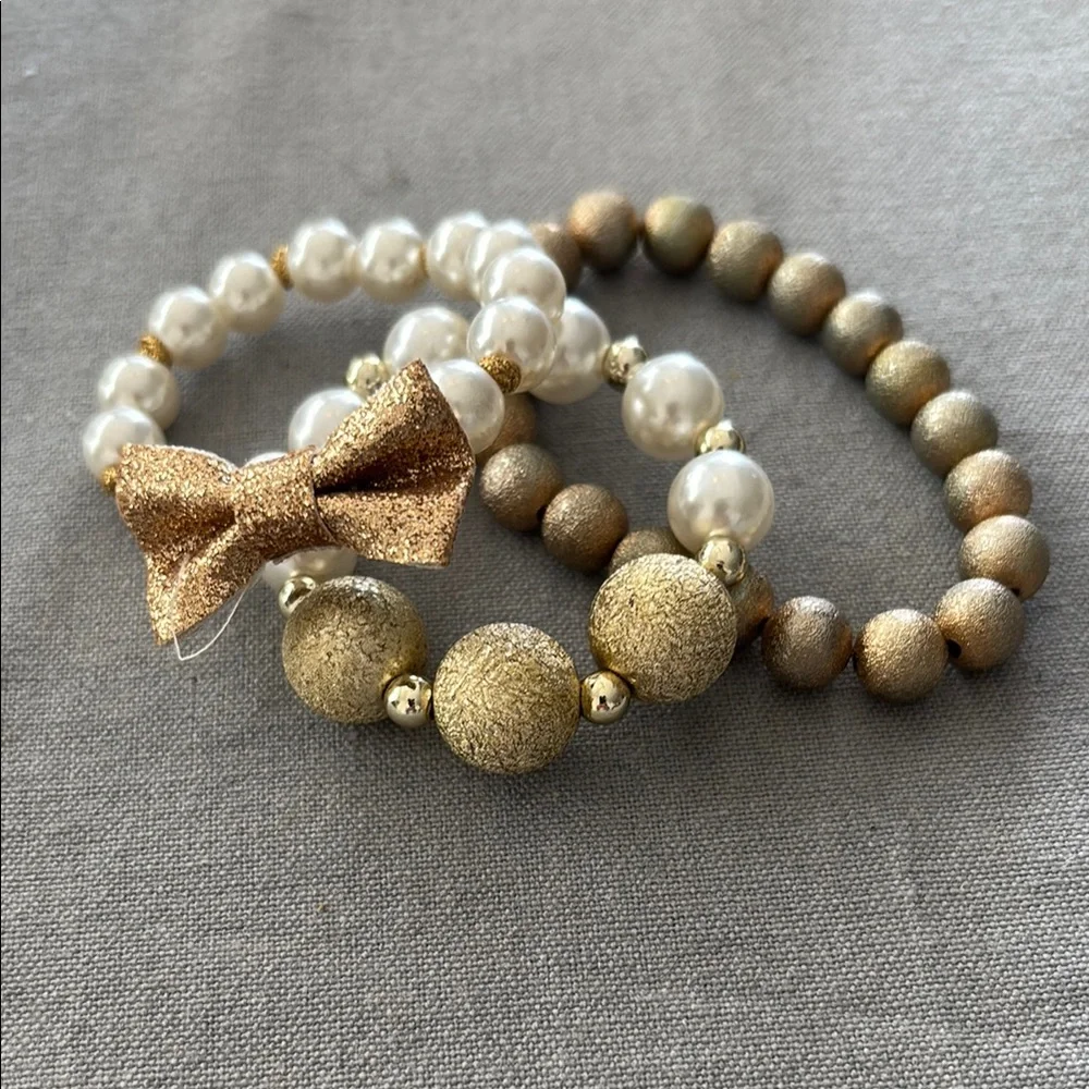 Gold and Cream Jewelry Set with Elegant Bow Charm